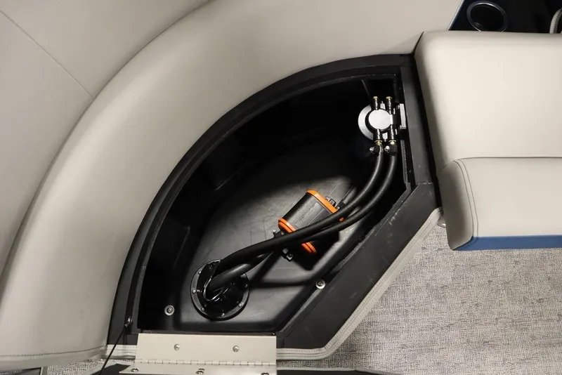 Slide: The Image of Storage compartment in 2025 Trifecta 22RF LE 2.75 boat, featuring cables and equipment. - 38