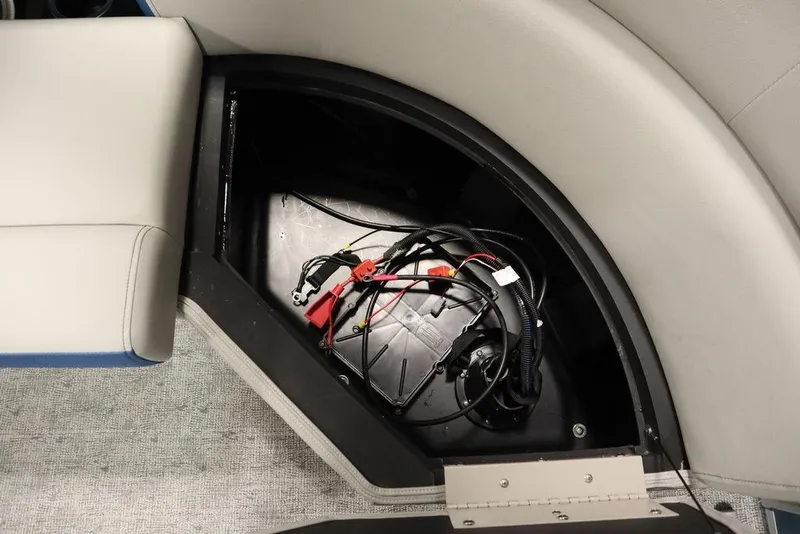 Slide: The Image of 2025 Trifecta 22RF LE 2.75 boat storage compartment with wiring and cables. - 39