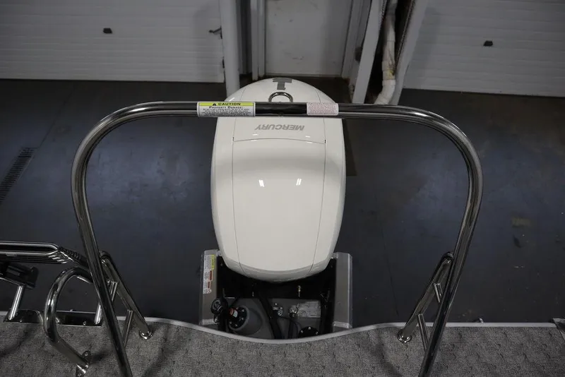 Slide: The Image of 2025 Trifecta 22RF LE 2.75 boat with Mercury outboard motor in a garage. - 42