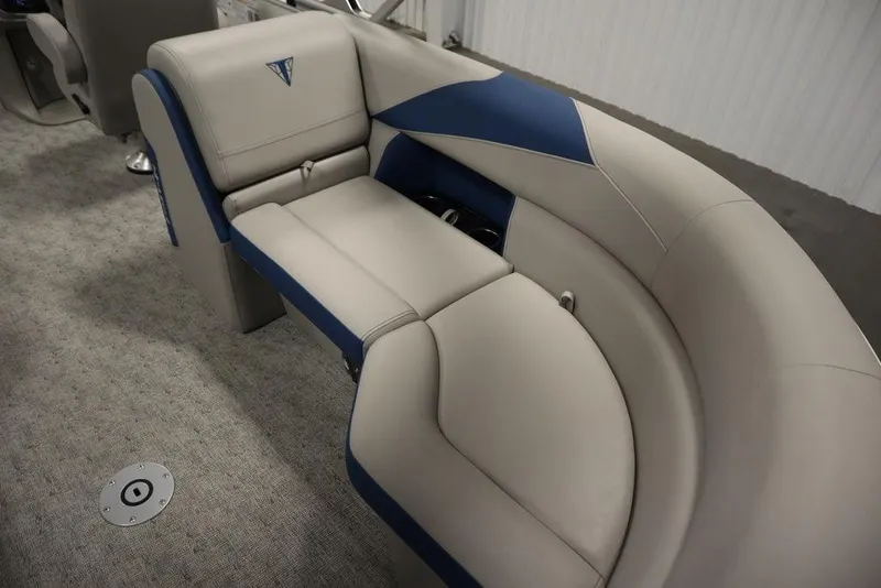 Slide: The Image of Luxurious seating on 2025 Trifecta 22RF LE 2.75 pontoon boat, featuring beige and blue upholstery. - 43