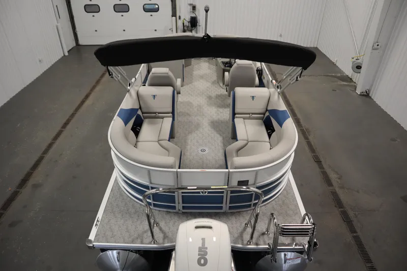 Slide: The Image of 2025 Trifecta 22RF LE 2.75 pontoon boat in a showroom setting. - 8