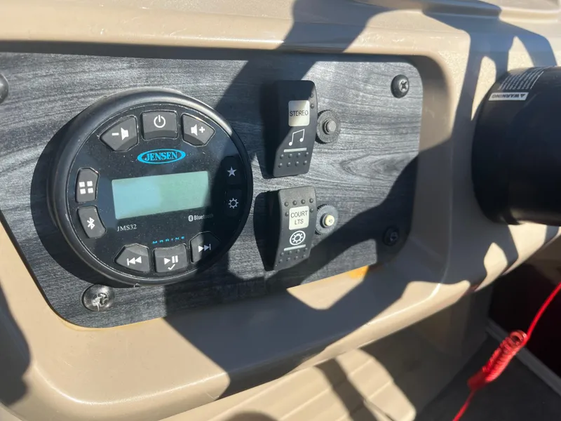 Slide: The Image of Control panel of 2020 Starcraft LX22R boat with Jensen audio system. - 10