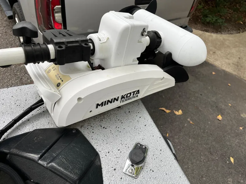 Slide: The Image of Minn Kota Terrova motor on Xpress H22 boat, 2022 model, parked on pavement. - 13