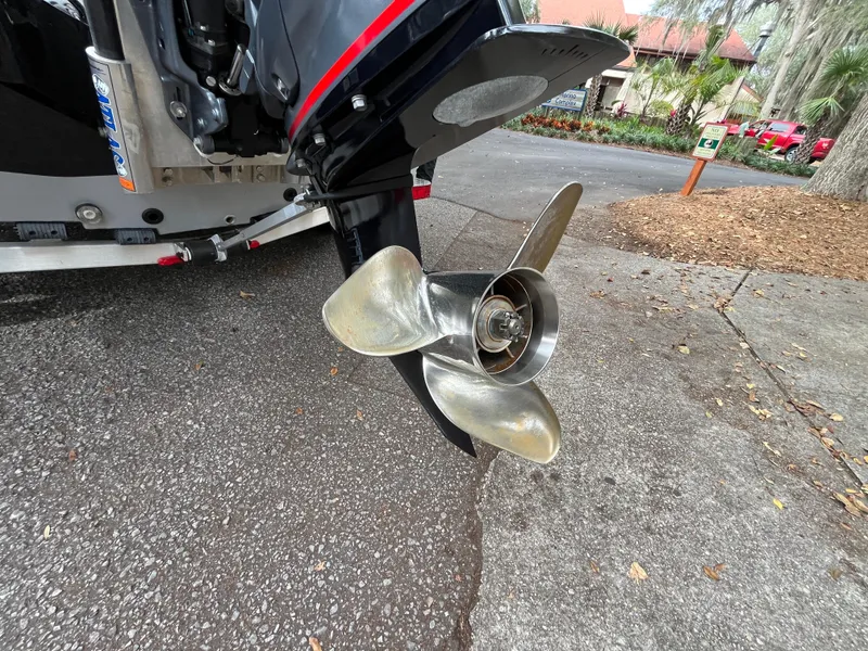 Slide: The Image of Propeller of 2022 Xpress H22 boat on pavement, close-up view. - 15