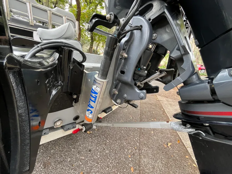 Slide: The Image of 2022 Xpress H22 boat motor and hydraulic system close-up. - 16