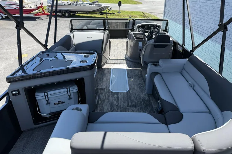 Slide: The Image of Interior of 2025 Avalon 2385 LSZ Elite Windshield pontoon boat with seating and helm. - 10