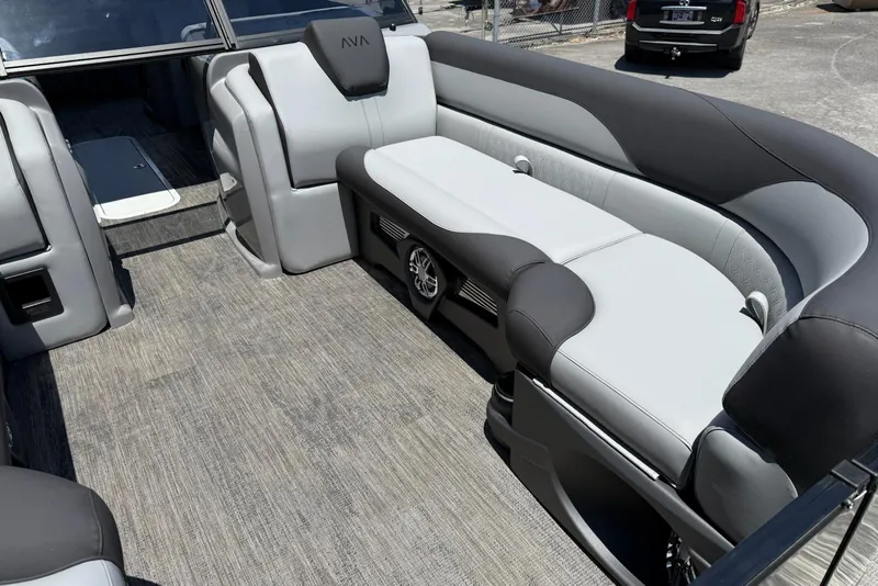 Slide: The Image of 2025 Avalon 2385 LSZ Elite Windshield boat interior with gray seating and flooring. - 8