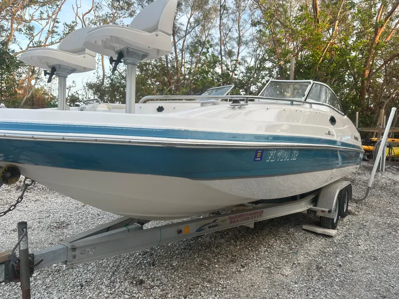 Slide: The Image of 2007 Hurricane SunDeck 237 OB boat on trailer, parked outdoors. - 1