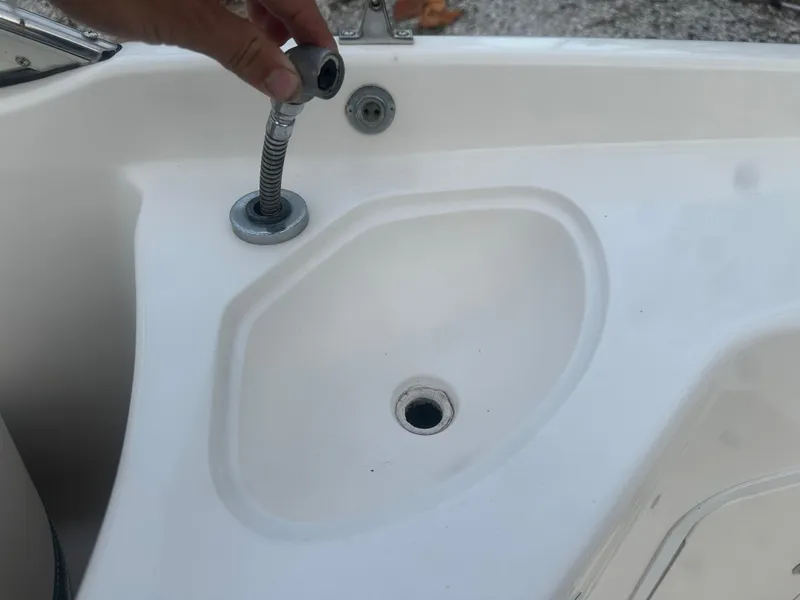 Slide: The Image of 2007 Hurricane SunDeck 237 OB boat sink with faucet detail. - 15