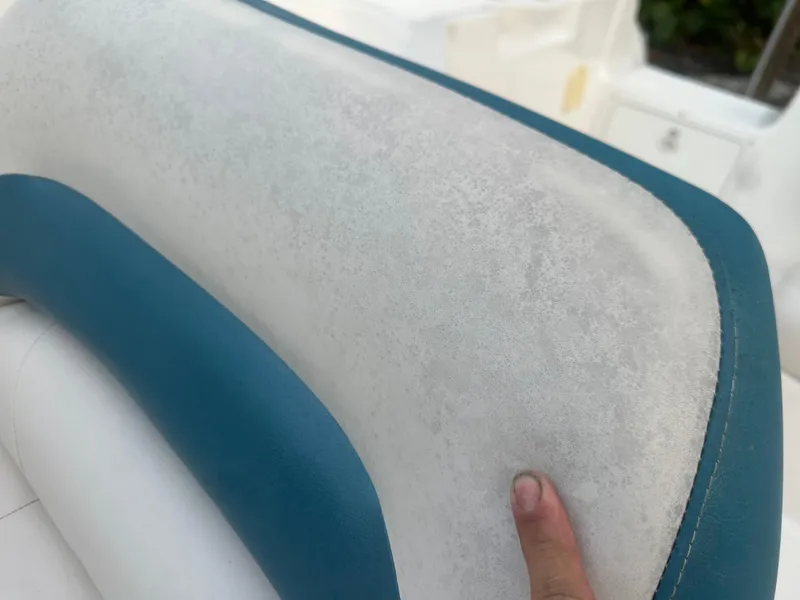 Slide: The Image of Close-up of a 2007 Hurricane SunDeck 237 OB boat seat with blue and white upholstery. - 18