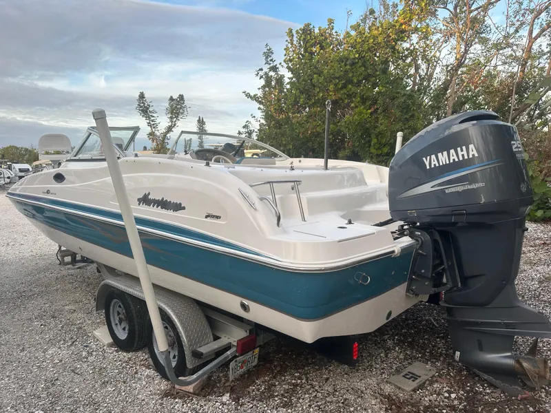 Slide: The Image of 2007 Hurricane SunDeck 237 OB boat with Yamaha engine on trailer. - 2