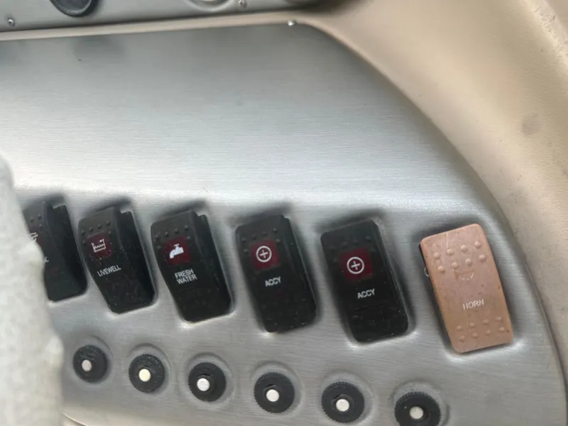 Slide: The Image of Dashboard controls of a 2007 Hurricane SunDeck 237 OB boat. - 23