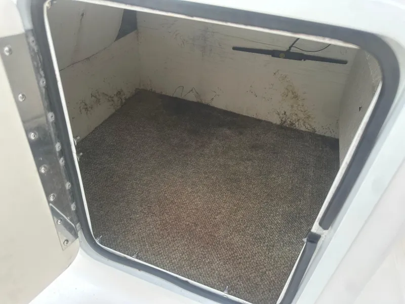 Slide: The Image of Storage compartment of a 2007 Hurricane SunDeck 237 OB boat, showing interior space. - 29