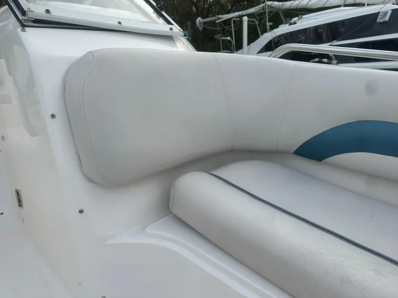 Slide: The Image of 2007 Hurricane SunDeck 237 OB boat seating with white and blue upholstery. - 32