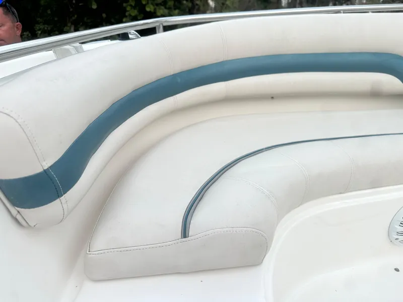 Slide: The Image of 2007 Hurricane SunDeck 237 OB boat interior with white and blue seating. - 33