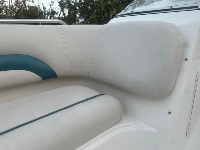 Slide: The Image of 2007 Hurricane SunDeck 237 OB boat seat with white and blue upholstery. - 34