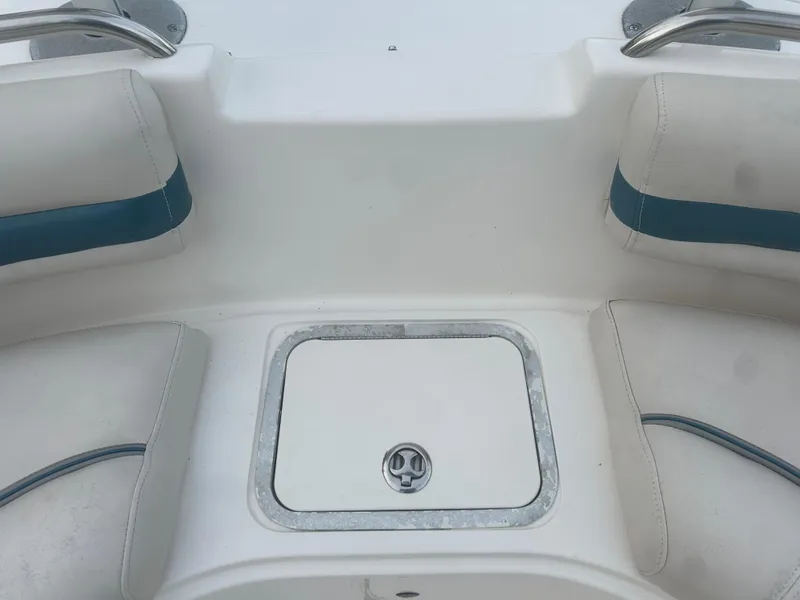Slide: The Image of 2007 Hurricane SunDeck 237 OB boat seating area with storage compartment. - 36