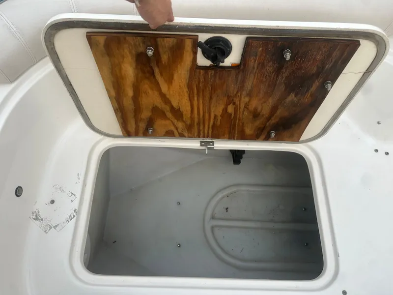 Slide: The Image of Storage compartment on 2007 Hurricane SunDeck 237 OB boat with wooden lid. - 38