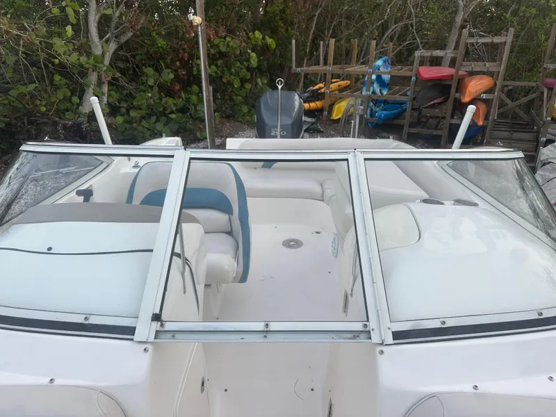 Slide: The Image of 2007 Hurricane SunDeck 237 OB boat with seating, windshield, and outdoor storage area. - 39