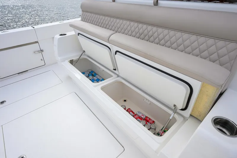 Slide: The Image of Valhalla Boatworks V-46 Center Console 2022 with open storage compartments and cushioned seating. - 10
