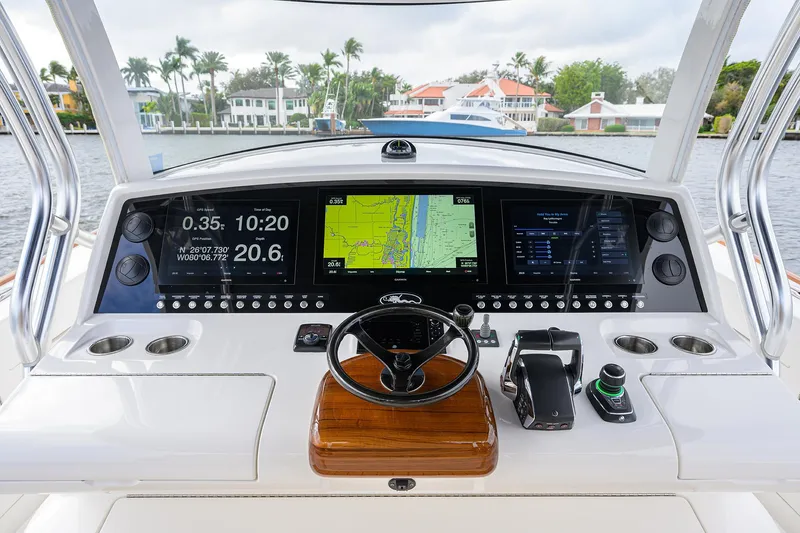 Slide: The Image of Valhalla Boatworks V-46 Center Console 2022 dashboard with advanced navigation displays. - 13