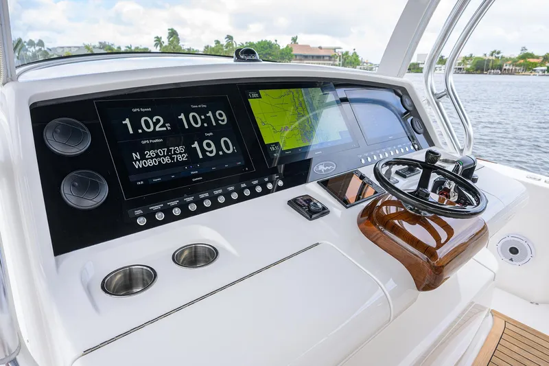 Slide: The Image of 2022 Valhalla V-46 Center Console helm with advanced navigation displays and controls. - 14