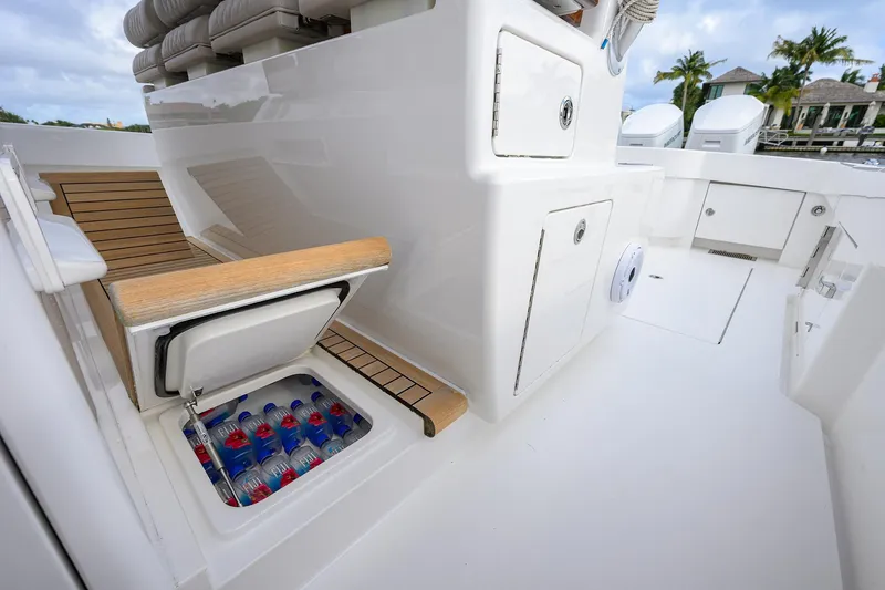 Slide: The Image of 2022 Valhalla V-46 Center Console boat with open cooler and seating area. - 15