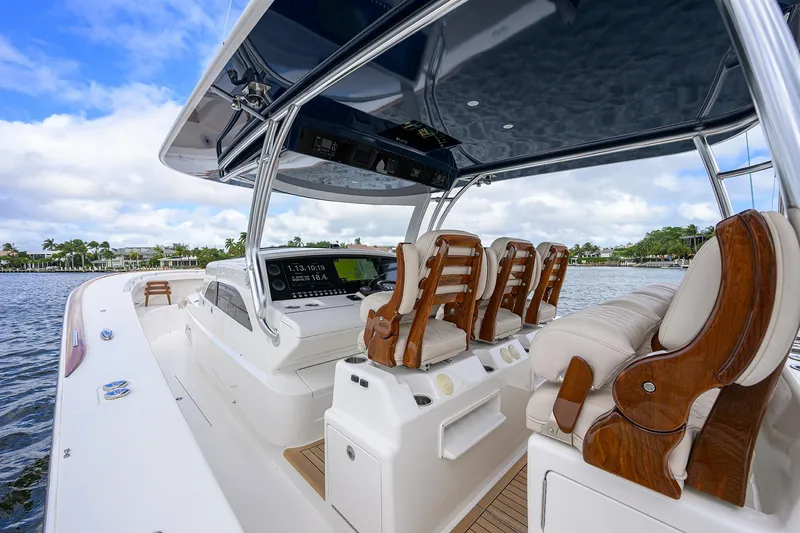 Slide: The Image of 2022 Valhalla V-46 Center Console boat with luxurious seating and sleek design on the water. - 16