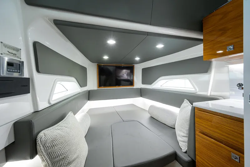 Slide: The Image of Luxurious interior of 2022 Valhalla V-46 Center Console boat with modern seating and TV. - 20