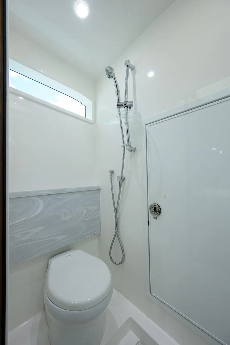Slide: The Image of 2022 Valhalla V-46 Center Console bathroom with shower and toilet. - 23