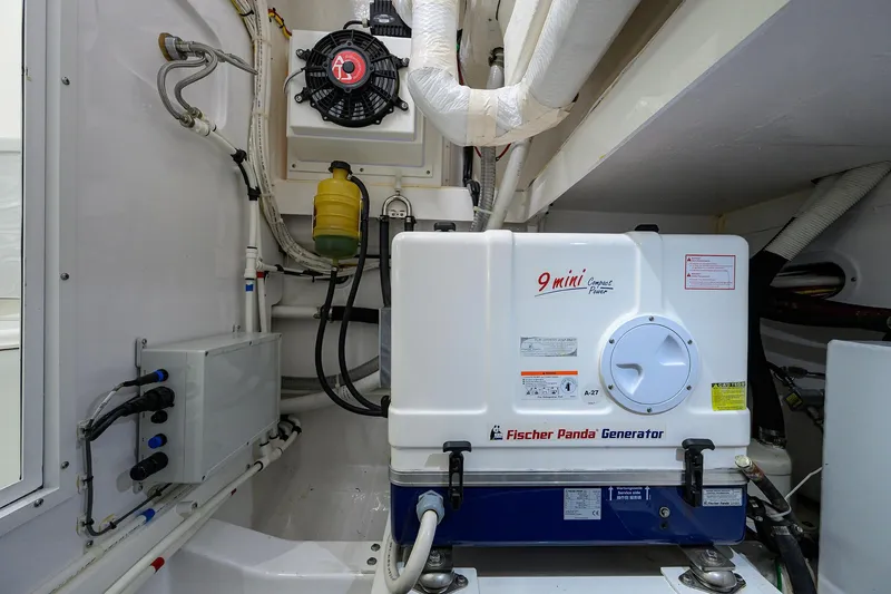 Slide: The Image of 2022 Valhalla V-46 Center Console engine room with Fischer Panda generator. - 25