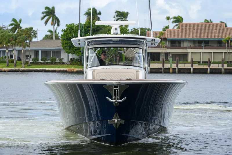 Slide: The Image of 2022 Valhalla Boatworks V-46 Center Console cruising on a calm waterway. - 28