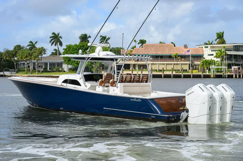 Slide: The Image of 2022 Valhalla Boatworks V-46 Center Console on water, featuring sleek design and powerful engines. - 31