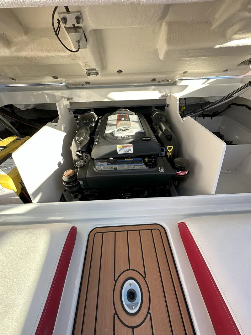 Slide: The Image of 2025 Crownline 240 SS boat engine compartment with open hatch. - 9