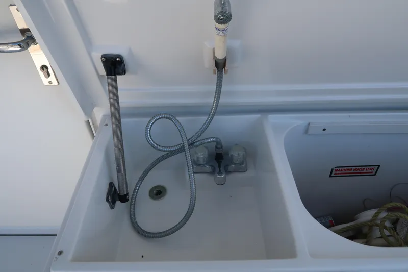 Slide: The Image of Luhrs 40 Convertible 2002 boat sink with faucet and hose attachment. - 10