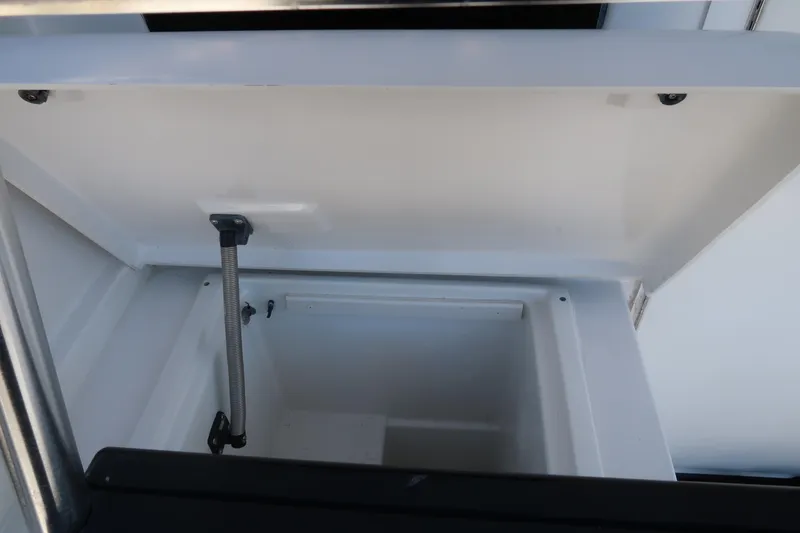 Slide: The Image of Open storage compartment on 2002 Luhrs 40 Convertible boat. - 11