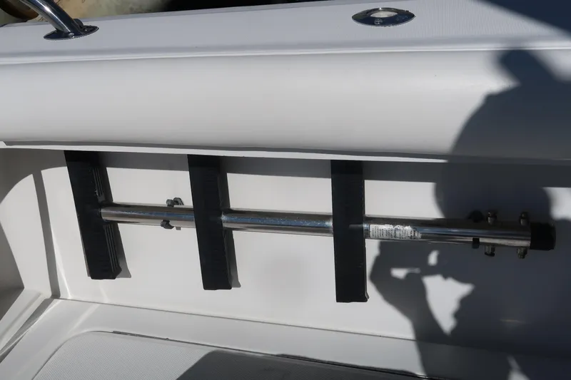 Slide: The Image of Luhrs 40 Convertible 2002 boat interior detail with metal rod holder. - 14