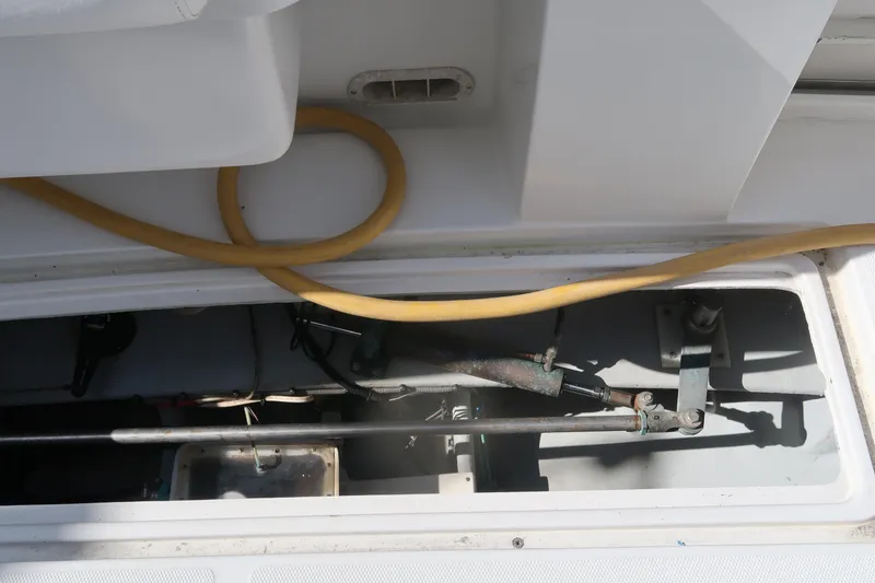 Slide: The Image of Engine compartment of 2002 Luhrs 40 Convertible boat with visible mechanical components. - 15