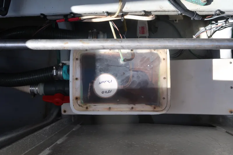 Slide: The Image of Engine compartment of 2002 Luhrs 40 Convertible boat, showing mechanical components and wiring. - 16