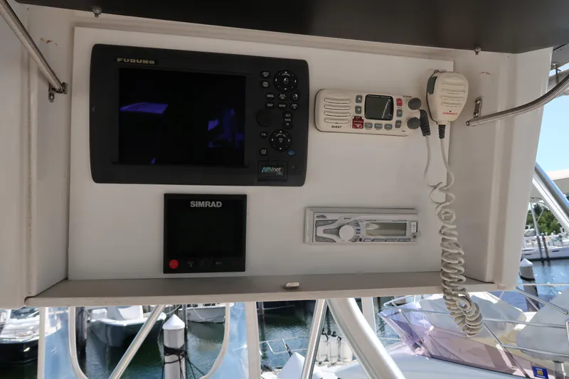 Slide: The Image of 2002 Luhrs 40 Convertible boat dashboard with navigation and communication equipment. - 18