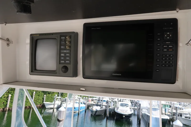 Slide: The Image of 2002 Luhrs 40 Convertible boat electronics with Garmin display at marina. - 19