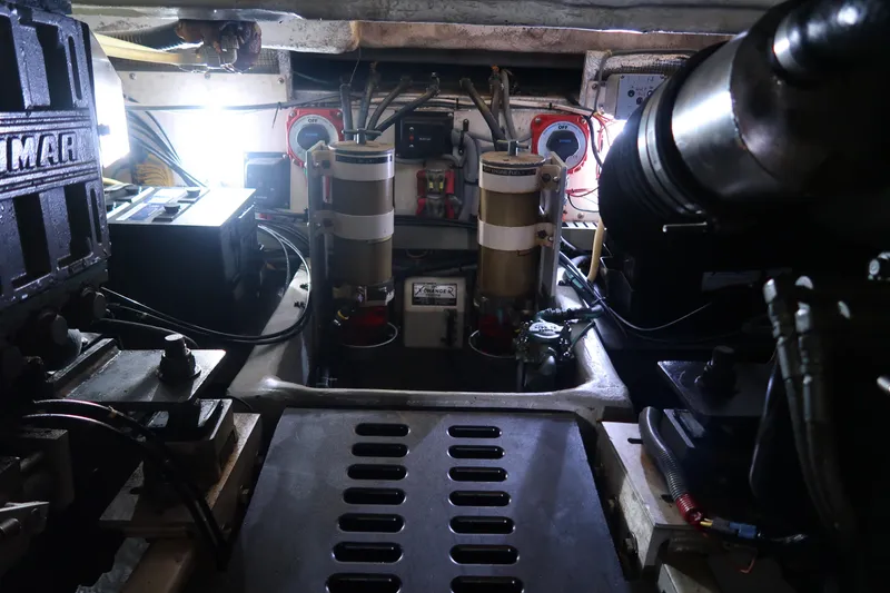 Slide: The Image of Engine room of 2002 Luhrs 40 Convertible boat, showcasing mechanical components and equipment. - 33