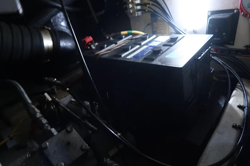 Slide: The Image of Battery compartment of 2002 Luhrs 40 Convertible boat, showing wiring and connections. - 35