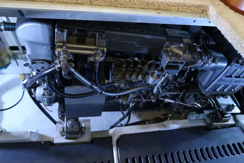 Slide: The Image of Engine compartment of 2002 Luhrs 40 Convertible boat, showcasing detailed mechanical components. - 36
