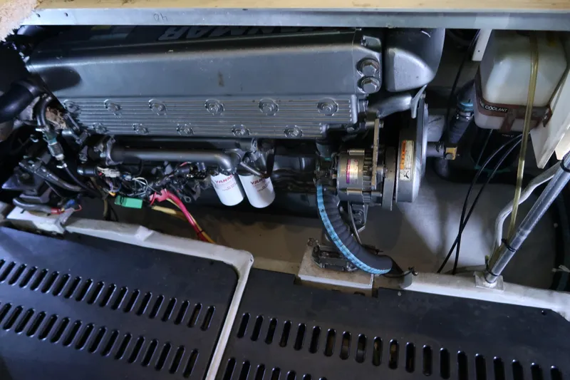 Slide: The Image of Engine compartment of 2002 Luhrs 40 Convertible boat, showcasing mechanical components. - 38