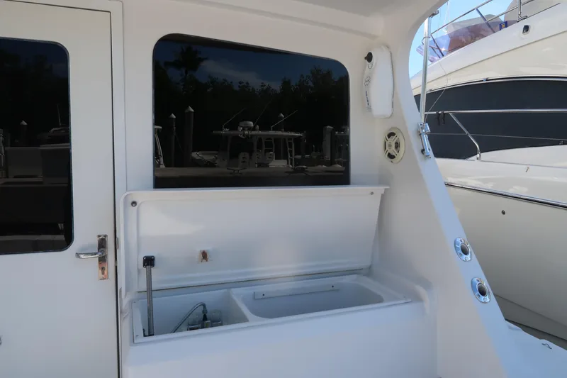 Slide: The Image of 2002 Luhrs 40 Convertible yacht interior with open storage compartment. - 9