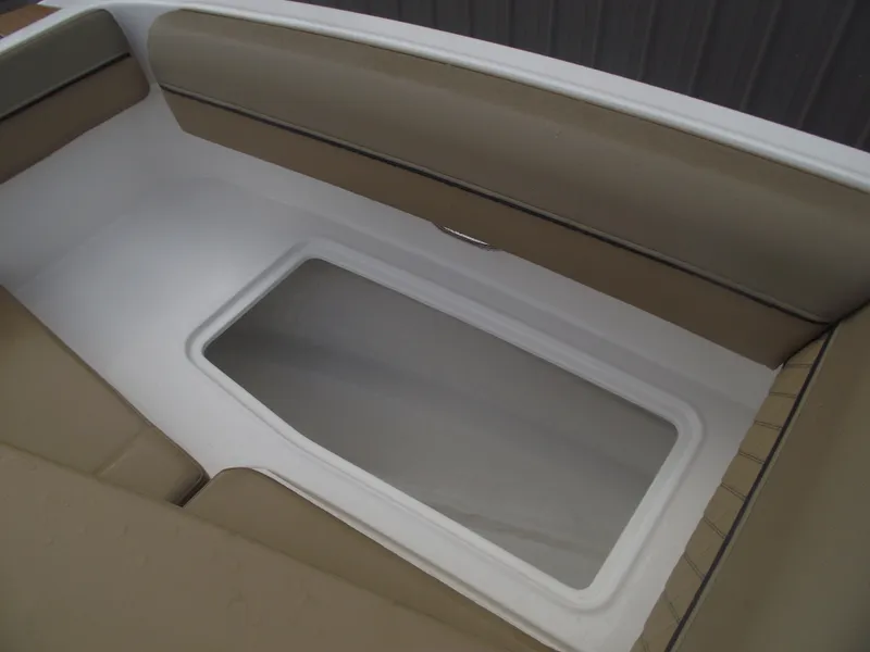 Slide: The Image of 2025 Bayliner D20 boat interior seating with storage compartment. - 11