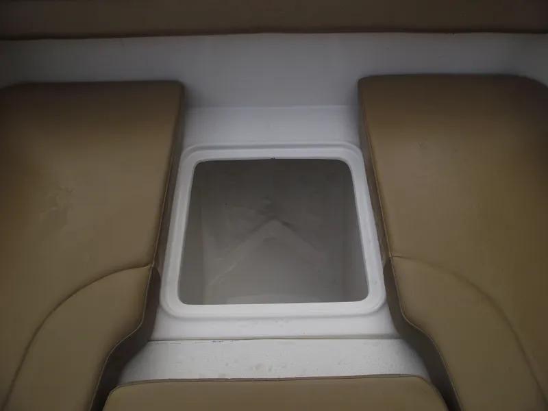 Slide: The Image of Bayliner D20 2025 boat interior seating with storage compartment. - 13