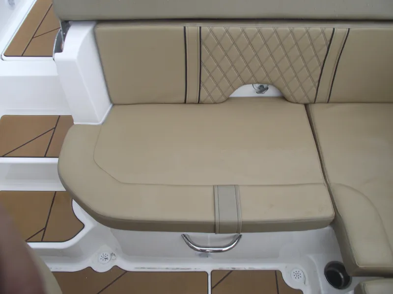 Slide: The Image of 2025 Bayliner D20 boat seat with beige upholstery and diamond stitching. - 27