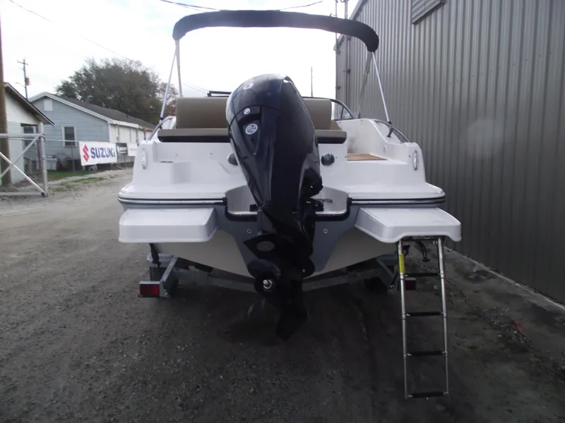 Slide: The Image of 2025 Bayliner D20 boat with outboard motor and ladder. - 3